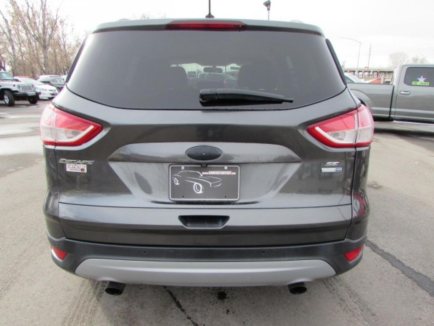 2015 Gray /Tan Ford Escape SE (1FMCU9G96FU) with an 2.0 I4 Ecoboost turbo engine engine, 6 speed automatic transmission, located at 4562 State Avenue, Billings, MT, 59101, (406) 896-9833, 45.769516, -108.526772 - 2015 Ford Escape SE 4WD 2.0 Ecoboost Turbo 4 cylinder engine - 6 speed automatic transmission - 4WD - 151,468 miles $256 per month - payment example based on $1000 cash or trade down - 36 months at 7.99 percent APR - on approved credit SE package - air conditioning - tilt and steering wheel - Photo#2